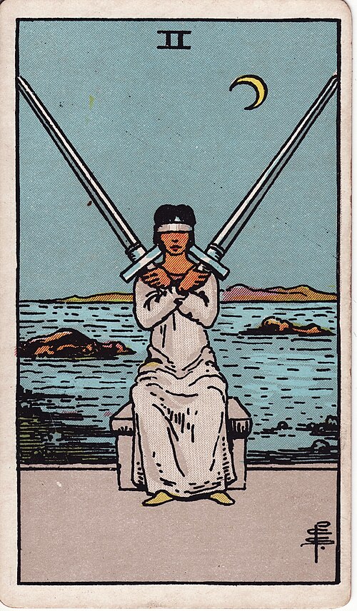 Two of Swords Meaning: Decisions, Love, and Reversed 1 Two of Swords tarot card, illustrated by Pamela Colman Smith in the original Rider–Waite–Smith deck
